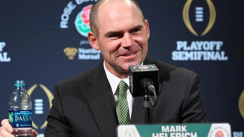 Oregon head coach Mark Helfrich speaks during Rose Bowl Media Day on Monday, Dec. 29, 2014 at the LA Hotel Downtown in Los Angeles. The Media Day was for the upcoming College Football Playoff Semifinal game of FSU versus Oregon at the Rose Bowl Game on January 1, 2015. (Stephen M. Dowell/Orlando Sentinel/TNS) Oregon coach Mark Helfrich worked for Falcons' Dirk Koettter at three schools (Stephen M. Dowell/Orlando Sentinel)