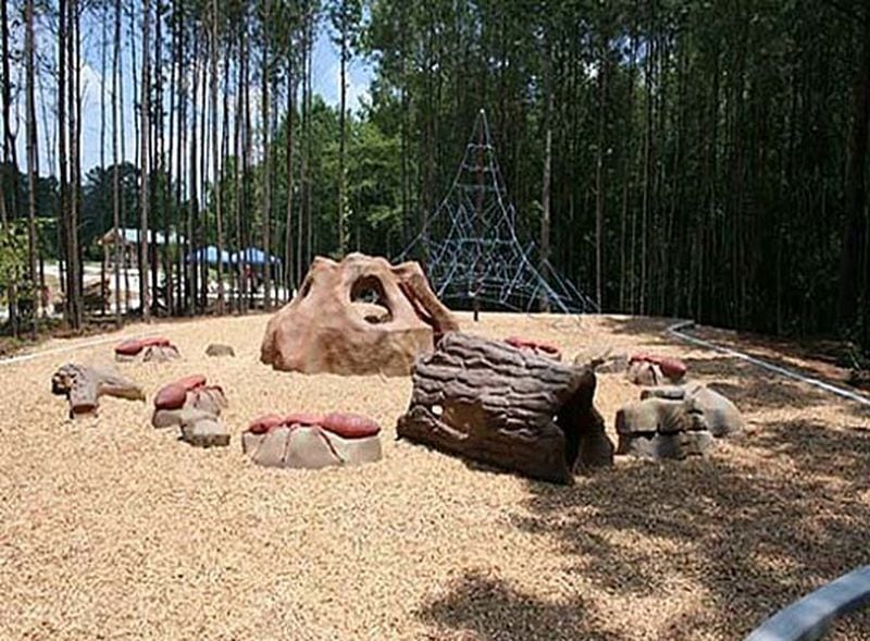 A "dinosaur dig" is a popular feature of the Caney Creek Preserve playground in Cumming, Georgia.