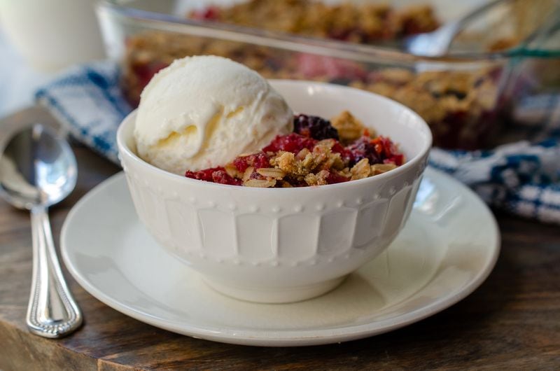 Reduced Sugar Berry Crisp is fruit-forward, enhanced with the zesty flavor of ginger. (Virginia Willis for The Atlanta Journal-Constitution)