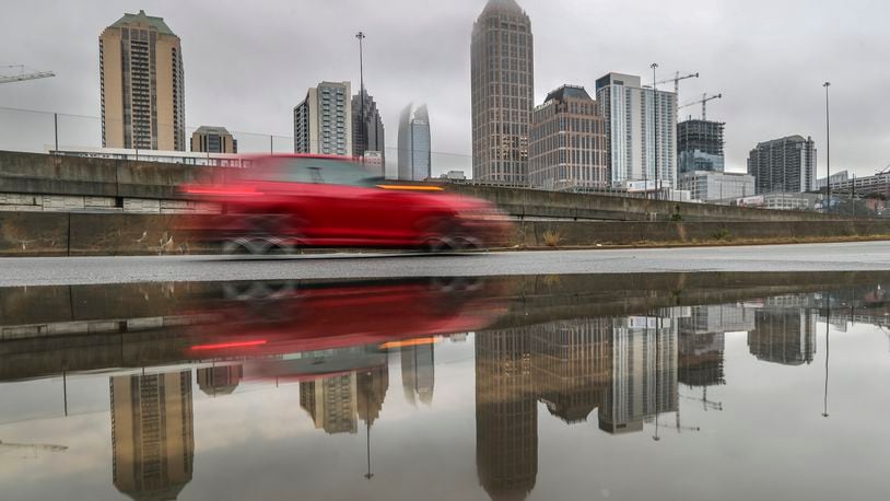 If you have to drive in heavy rain, slow down and allow yourself extra time, Atlanta police agencies suggest. Hazard lights aren't necessary unless in an emergency.