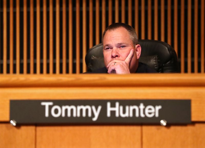 Tommy Hunter, the District 3 leader who recently called U.S. Rep. John Lewis a racist pig on Facebook, listens during a Gwinnett County Board of Commissioners public hearing on Feb. 28, 2017, in Lawrenceville. (Curtis Compton/ccompton@ajc.com)
