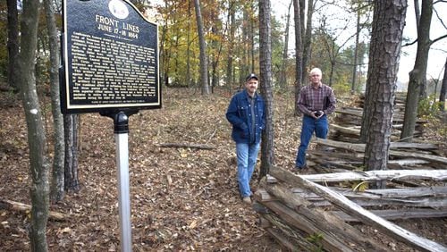 Jeff Wright (left) and William Lathem at a preserved Civil War site in Cobb County marking the June 1864 battle line between Federal and Confederate forces. JEFF WRIGHT PHOTO