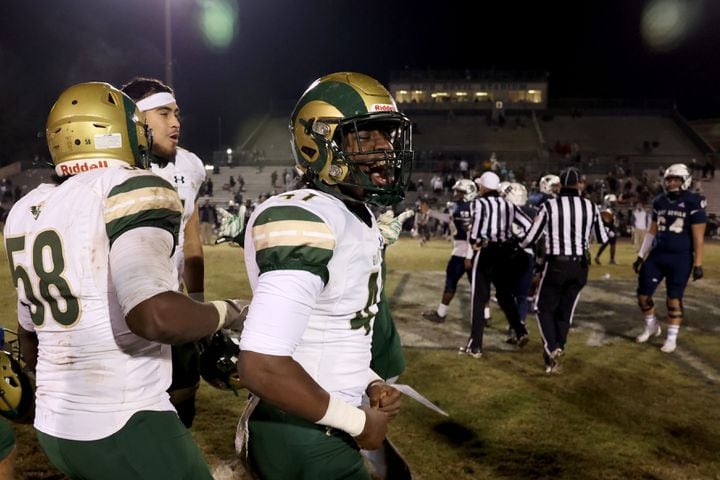 Dec. 18, 2020 - Norcross, Ga: Grayson linebacker Jalen Smith (41, center) celebrates with teammates after their 28-0 win against Norcross during the Class AAAAAAA semi-final game at Norcross high school Friday, December 18, 2020 in Norcross, Ga.. Grayson won 28-0 to advance to the Class AAAAAAA finals. JASON GETZ FOR THE ATLANTA JOURNAL-CONSTITUTION
