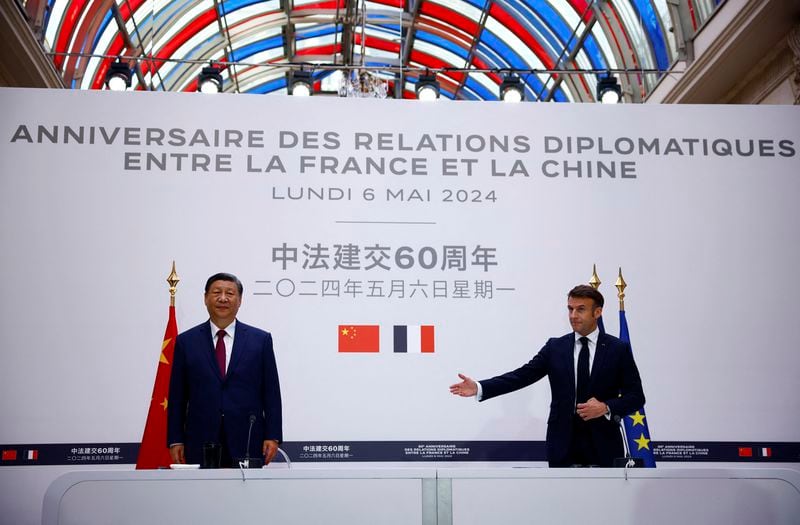 China's President Xi Jinping, left, attends a joint statement with French President Emmanuel Macron at the Elysee Palace in Paris as part of the Chinese president's two-day state visit in France, Monday, May 6, 2024. French President Emmanuel Macron put trade disputes and Ukraine-related diplomatic efforts on top of the agenda for talks Monday with Chinese President Xi Jinping, who arrived in France for a two-day state visit opening his European tour. (Sarah Meyssonnier/Pool via AP)