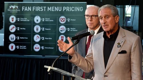 Falcons owner Arthur Blank, right, with team president Rich McKay, announced "fan first" menu pricing in 2016 but the cost to get into a Falcons' game in 2017 is hardly "fan first." (Brant Sanderlin / Atlanta Journal-Constitution)
