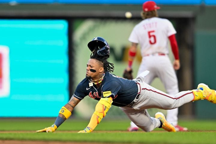 Atlanta Braves’ Ronald Acuna Jr. (13) dives toward second base on a double against the Philadelphia Phillies during the third inning of NLDS Game 3 in Philadelphia on Wednesday, Oct. 11, 2023.   (Hyosub Shin / Hyosub.Shin@ajc.com)