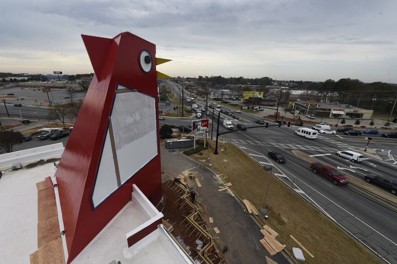 The Big Chicken got a fresh coat of paint Wednesday, March 22, 2017. Marietta's roadside icon at 12 Cobb Parkway is being renovated.