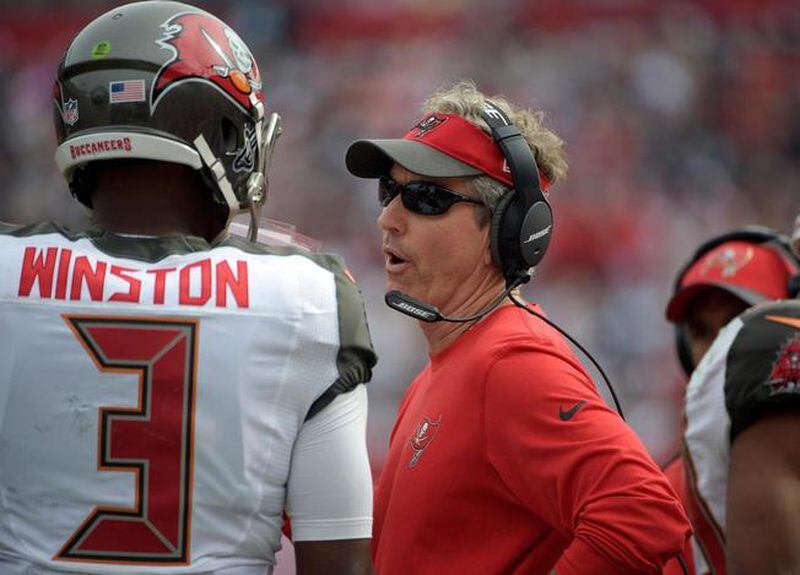  FILE - In this Nov. 15, 2015, file photo, Tampa Bay Buccaneers offensive coordinator Dirk Koetter talks to quarterback Jameis Winston (3) during an NFL football game against the Dallas Cowboys, in Tampa, Fla. The Tampa Bay Buccaneers announced that they have named Dirk Koetter the 11th head coach in franchise history, Friday, Jan. 15, 2016. (AP Photo/Phelan M. Ebenhack, File) The Associated Press
