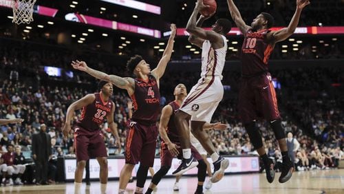 Florida State guard Dwayne Bacon (4) puts up a shot against Virginia Tech in the second half of an NCAA college basketball game during the quarterfinals of the Atlantic Coast Conference tournament, Thursday, March 9, 2017, in New York. Florida State won 74-68.(AP Photo/Julie Jacobson)