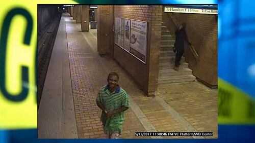 Police are still trying to identify another man seen in surveillance footage captured the night of the May 13 armed robbery. He was wearing a polo shirt with green and blue stripes (Credit: Crime Stoppers Greater Atlanta)