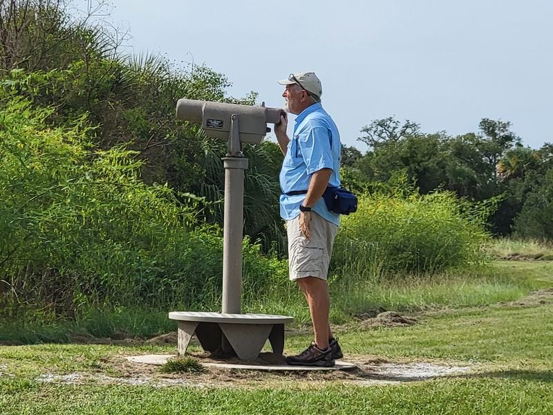 Dave Howitt, a guide at Pickney Island National Wildlife Refuge, points out sweeping views of the island. 
(Courtesy of Tracey Teo)