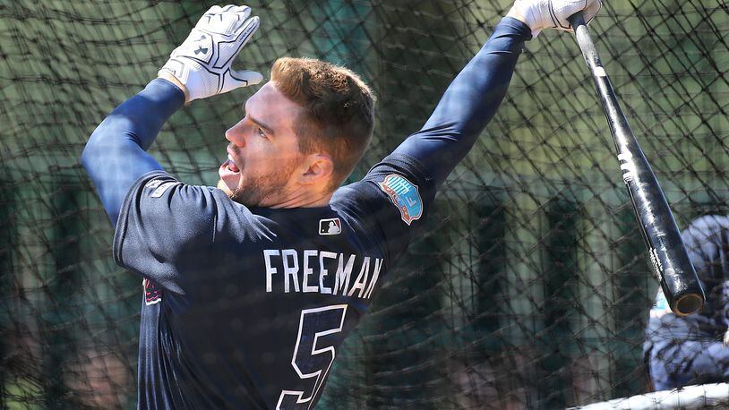Braves first baseman Freddie Freeman hits during batting practice at spring training at Disney’s Wide World of Sports. Freeman said he has never wavered in his commitment to the Braves during their makeover. (Curtis Compton/ccompton@ajc.com)