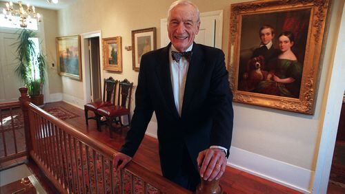 Cobb attorney Fred Bentley with some of the art he collected over the years. Bentley influenced the county, having a hand in founding or serving in institutions from government to local nonprofits. PHOTO BY ANDY SHARP/STAFF.