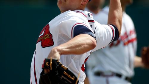 Atlanta Braves starting pitcher Kris Medlen (54) warms up from the mound before the first inning in a spring exhibition baseball game against the Washington Nationals, Tuesday, March 4, 2014, in Kissimmee, Fla. (AP Photo/Alex Brandon)