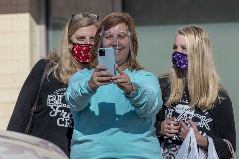 Lisa Hembree takes a selfie with her sister Krista Ellington (left) and niece Camryn Fields at the Fayette Pavilion on Friday.
