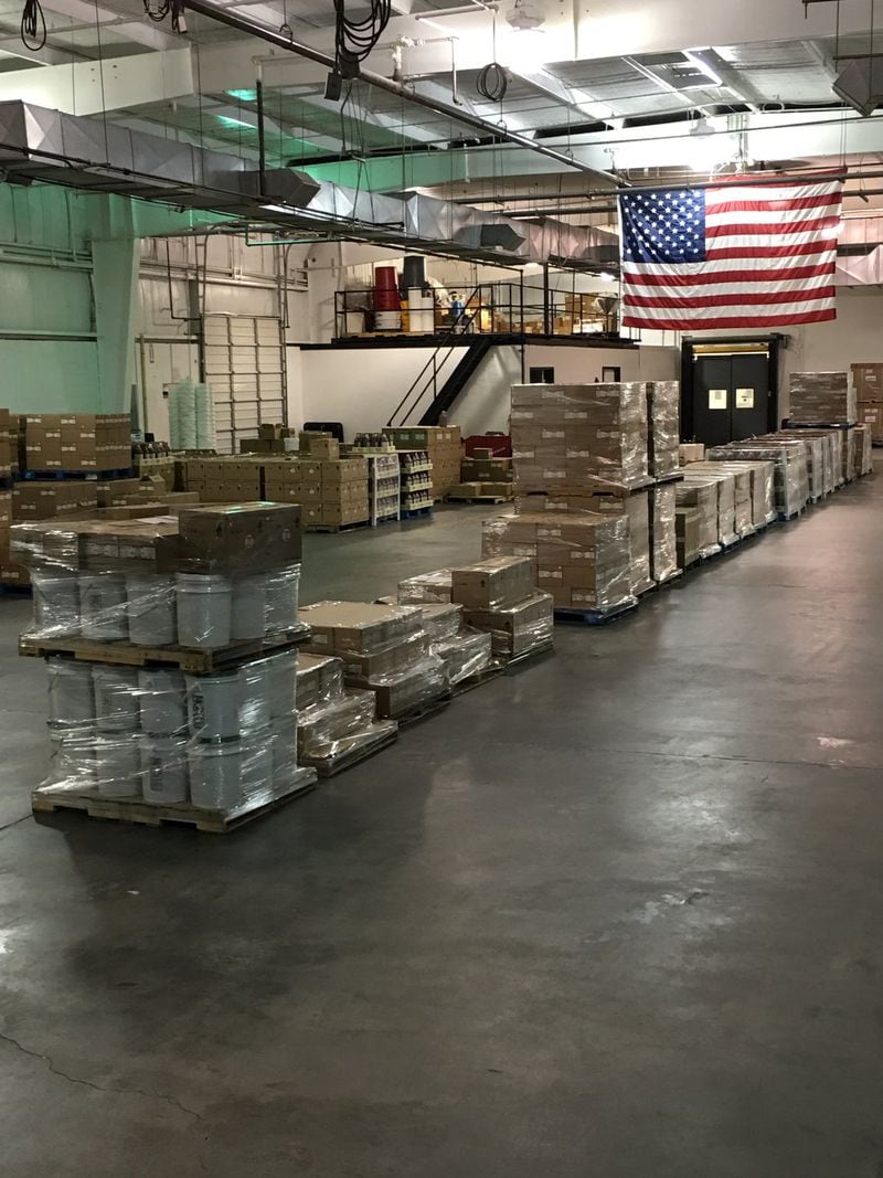Pallets of bottles and buckets of Williamson Bros. Bar-B-Q sauce sit awaiting distribution in the company’s 25,000-square-foot Marietta facility. CONTRIBUTED BY LESLIE SNEED
