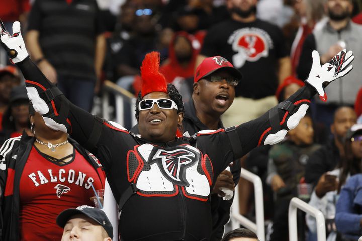 A Falcons fan reacts at the end of the regulation. The Falcons defeated the Panthers 37-34 in overtime Sunday.
 (Miguel Martinez / miguel.martinezjimenez@ajc.com)