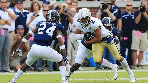 Ricky Jeune of the Georgia Tech Yellow Jackets is tackled by Darius Jones Jr. and Sean Freeman of the Georgia Southern Eagles during the first half at Bobby Dodd Stadium on October 15, 2016 in Atlanta, Georgia. (Photo by Daniel Shirey/Getty Images)