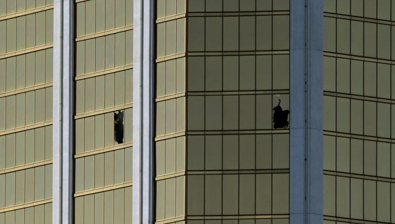 The damaged windows on the 32nd floor room that was used by the shooter in the Mandalay Hotel after a gunman killed at least 58 people and wounded more than 500 others when he opened fire on a country music concert in Las Vegas, Nevada on October 2, 2017. 
Police said the gunman, a 64-year-old local resident named as Stephen Paddock, had been killed after a SWAT team responded to reports of multiple gunfire from the 32nd floor of the Mandalay Bay, a hotel-casino next to the concert venue. / AFP PHOTO / Mark RALSTON        (Photo credit should read MARK RALSTON/AFP/Getty Images)