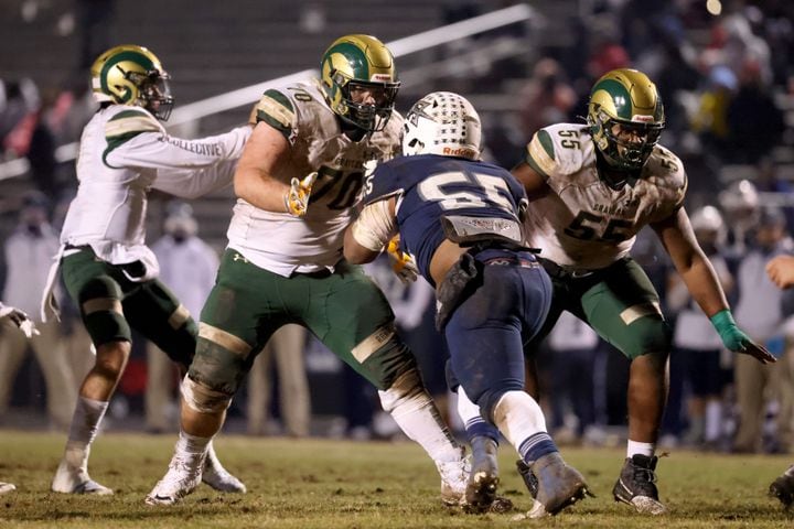 Dec. 18, 2020 - Norcross, Ga: Grayson offensive lineman Griffin Scroggs (70) and Walt Flynn (55) block Norcross defensive lineman Jared Brooks (55) in the second half of the Class AAAAAAA semi-final game at Norcross high school Friday, December 18, 2020 in Norcross, Ga.. JASON GETZ FOR THE ATLANTA JOURNAL-CONSTITUTION