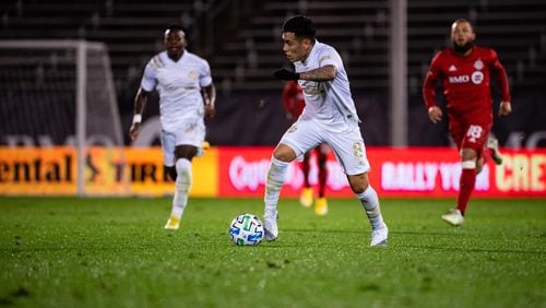 Ezequiel Barco dives the ball during Atlanta United's 1-0 loss to Toronto Sunday in Connecticut.