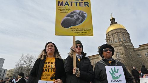 Anti-abortion advocates hold signs during the 2020 Georgia March For Life & Memorial Service to raise awareness and support of anti-abortion legislation at Liberty Plaza on Wednesday, January 22, 2020. (Hyosub Shin / Hyosub.Shin@ajc.com)