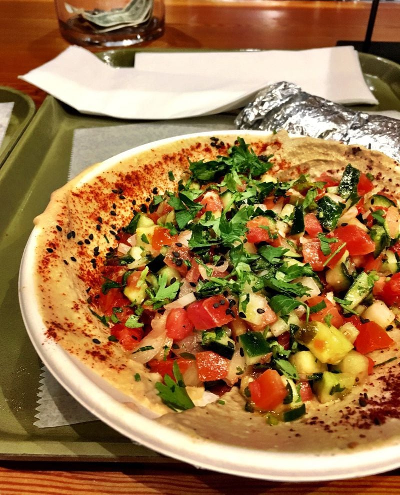 The Israeli salad from Yalla has hummus, baba ganoush, tomatoes, cucumber, onion, and parsley. Yalla is part of the Canteen in Midtown. CONTRIBUTED BY WYATT WILLIAMS