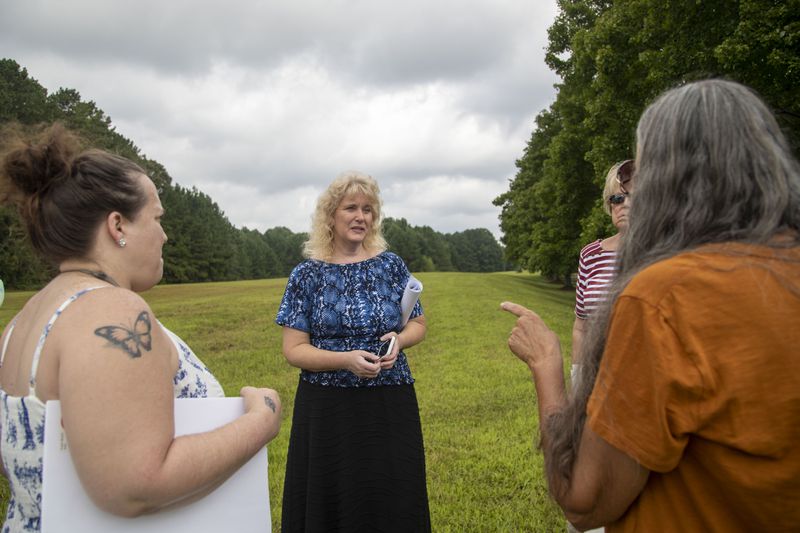 Tullan Avard, executive director of the Bells Ferry Civic Association, speaks with members of the group and other concerned citizens during a meetup in Kennesaw, Wednesday, September 8, 2021.  (Alyssa Pointer/Atlanta Journal Constitution)
