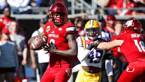 ORLANDO, FL - DECEMBER 31: Lamar Jackson #8 of the Louisville Cardinals looks to pass against the LSU Tigers in the first quarter of the Buffalo Wild Wings Citrus Bowl at Camping World Stadium on December 31, 2016 in Orlando, Florida. (Photo by Joe Robbins/Getty Images)