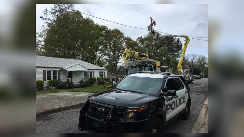 A drunken driver crashed into a utility pole, knocked down power lines and took out a fence in Marietta, police said. (Credit: Channel 2 Action News)