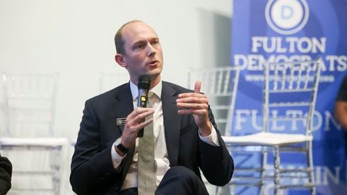 Fulton County Superior Court Judge Scott McAfee, nonpartisan, speaks during the 2024 Town Hall for North Fulton Democratic and Nonpartisan Candidates at Memories Event Space, Tuesday, April 30, 2024, in Johns Creek, Ga.  (Jason Getz / AJC)
