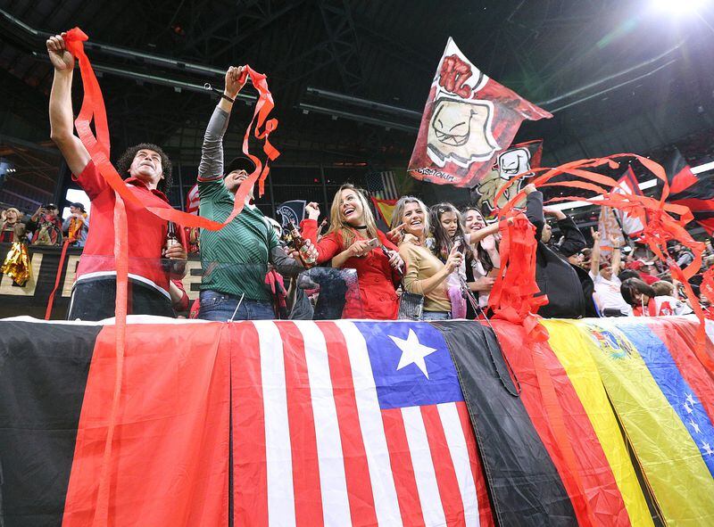 Atlanta United fans celebrate a 3-0 victory over the New York Red Bulls during the second half in their Eastern Conference finals MLS soccer game on Sunday, Nov. 25 in Atlanta. Curtis Compton/ccompton@ajc.com