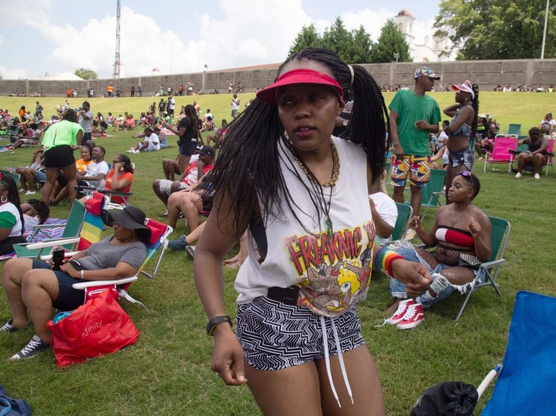 Jgenisius Harris dances to the music in her 1995  Freaknik shirt during FreakNik Atlanta ‘19 - The Festival at the Cellairis Amphitheatre at Lakewood on Saturday, June 22, 2019. Harris said her family went to the 1995 Freaknik and she got the T-shirt. (Photo: STEVE SCHAEFER / SPECIAL TO THE AJC)