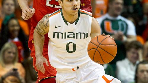 Shane Larkin of Miami leads the break with Alex Len of Maryland trailing in the first half of a men's college basketball game at the BankUnited Center on Sunday, January 13, 2013, in Coral Gables, Florida. (C.W. Griffin/Miami Herald/MCT)