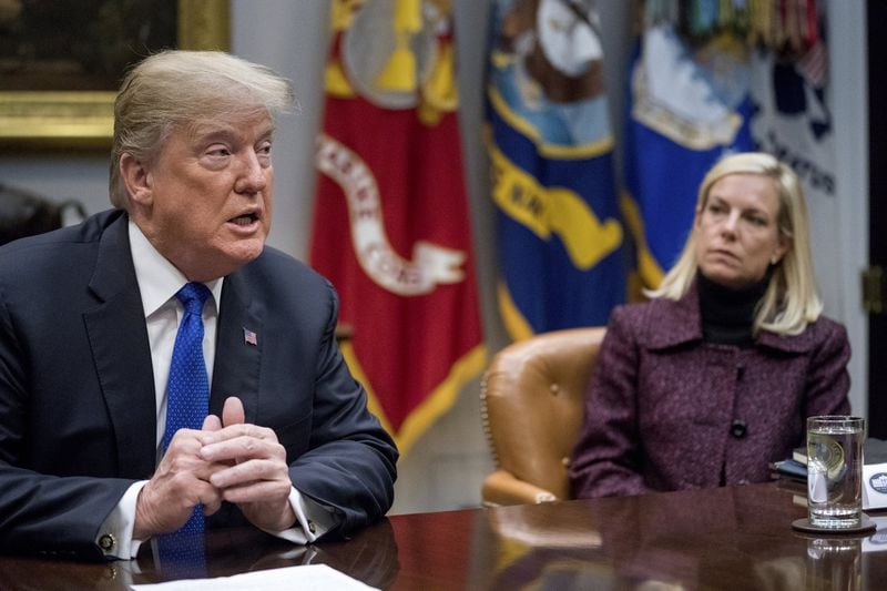 President Trump, with Secretary of Homeland Security Kirstjen Nielsen, right, speaks during a meeting with Republican Senators on immigration at the White House last week. (AP Photo/Andrew Harnik, File)