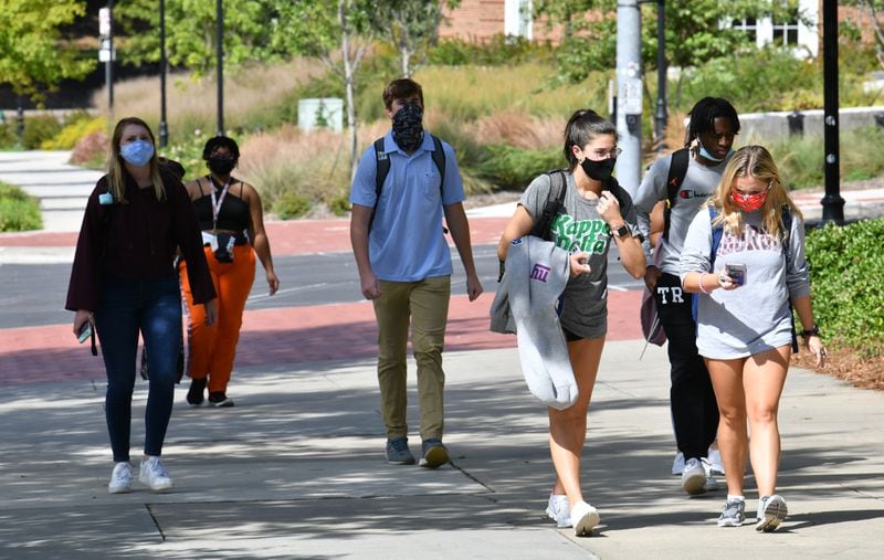 Students mostly wear masks as they make their way through the University of Georgia campus in Athens in September. Athens-Clarke County Mayor Kelly Girtz said he’s not yet ready to bring back a mask mandate that local lawmakers enacted last summer during a surge of new cases. But he says he’s about an uptick in infections over the past month that tripled from a low point earlier this year. He plans to keep pushing for more vaccinations. (Hyosub Shin / Hyosub.Shin@ajc.com)