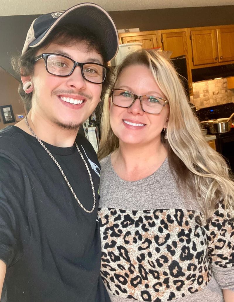 Collin Graham and his mother, Jenny Miller, at her house in 2020. “Over the years I’ve seen a lot of things that made me change my way of thinking,” Miller says, “because I would never want my child to feel like I don't love him because he is transgender or the person he loves is different than what I expected.” Courtesy of Collin Graham