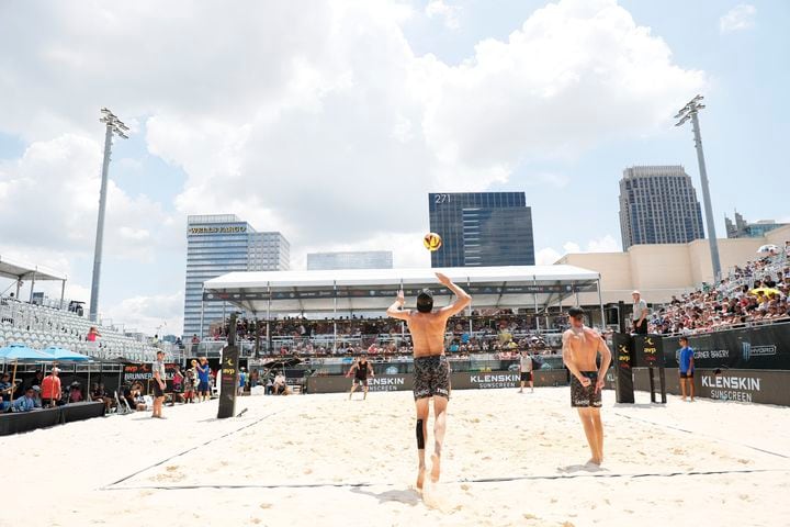 Theo Brunner serves the ball during the second set of the AVP Gold Series Atlanta Open beach volleyball men's championship match Sunday at Atlantic Station. (Miguel Martinez / miguel.martinezjimenez@ajc.com)