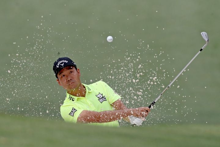 April 8, 2021, Augusta: Kevin Na hits out of the bunker on the tenth hole during the first round of the Masters at Augusta National Golf Club on Thursday, April 8, 2021, in Augusta. Curtis Compton/ccompton@ajc.com