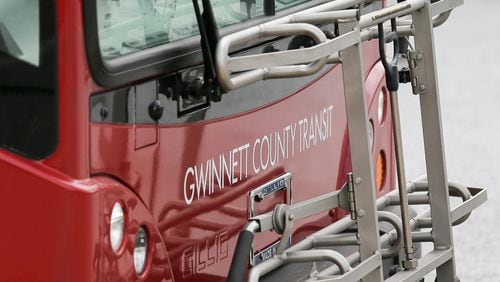 The exterior of a Gwinnett County Transit bus is displayed at a Gwinnett County Transit bus center near Gwinnett Place Mall in Duluth. (ALYSSA POINTER/ALYSSA.POINTER@AJC.COM) AJC FILE PHOTO