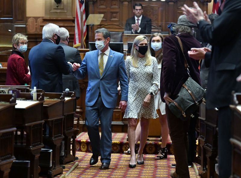 Gov. Brian Kemp and first lady Marty Kemp greet lawmakers as they leave after he delivered the State of the State address in the House Chambers on Thursday. (Hyosub Shin / Hyosub.Shin@ajc.com)