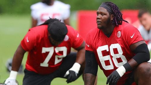 Falcons guard Jamon Brown loosens up for the second practice at training camp Tuesday, July 23, 2019, in Flowery Branch.