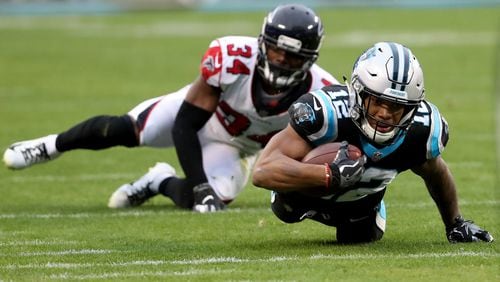 Brian Poole (34) of the Falcons can’t stop D.J. Moore of the Carolina Panthers. (Photo by Streeter Lecka/Getty Images)