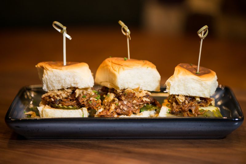  Pulled Pork Sliders with crispy onions, pickles, and King's Hawaiian rolls. Photo credit- Mia Yakel.
