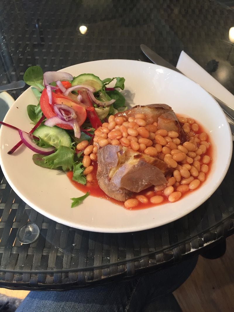The British like to use unusual toppings for what they call a jacket potato. Here is one topped with baked beans, and served with a side salad, at the Cwtch Cafe in Abergavenny, Wales. (Courtesy of Olivia King)