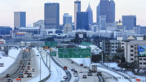 Traffic built on the Downtown Connector on a snowy Wednesday morning.
