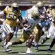 Georgia Tech running back Jamal Haynes (11) takes off ahead of Georgia Tech defensive lineman Ayo Tifase (50) in the first quarter during the Spring White and Gold game at Bobby Dodd Stadium at Hyundai Field In Atlanta on Saturday, April 13, 2024.   (Bob Andres for the Atlanta Journal Constitution)