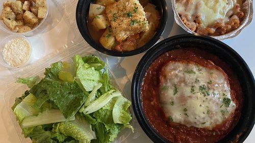 This takeout family meal for two from Aria includes a Caesar salad, oven-roasted filet of halibut in clam and tomato broth, and chicken parmigiana with baked cavatappi pasta. CONTRIBUTED BY BOB TOWNSEND