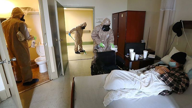 Georgia National Guardsmen disinfect a resident's room at a nursing home in Atlanta amid the coronavirus pandemic in April.