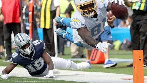 Mike Williams (81) of the Los Angeles Chargers dives for a touchdown against Damontae Kazee (18) of the Dallas Cowboys at SoFi Stadium on September 19, 2021 in Inglewood, California. (Ronald Martinez/Getty Images/TNS)